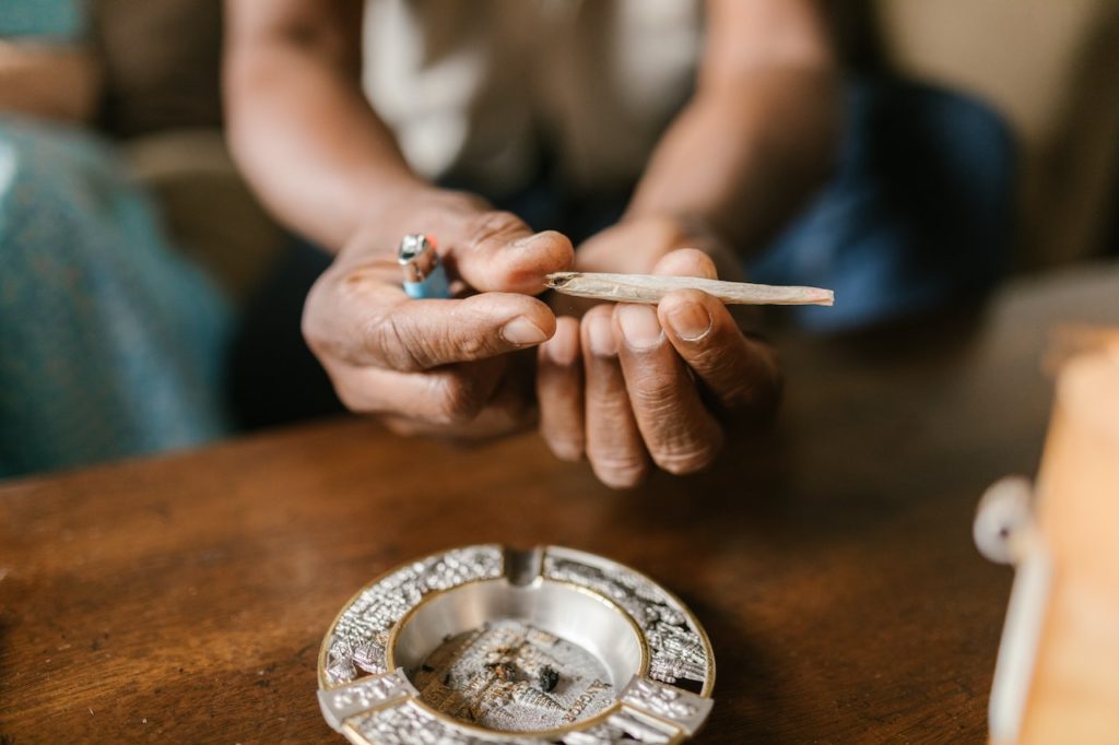 A person holding a CBD joint